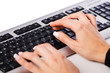 Hands working on the keyboard