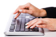 Hands working on the keyboard
