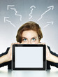 Business woman looking over her tablet pc with copyspace