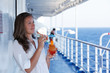 cute girl with a cocktail on a journey
