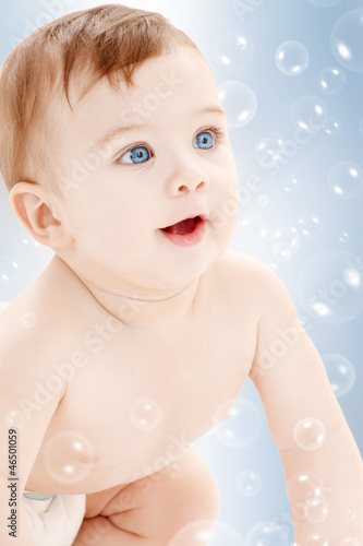 Photo: crawling baby boy looking up crawling baby boy looking up