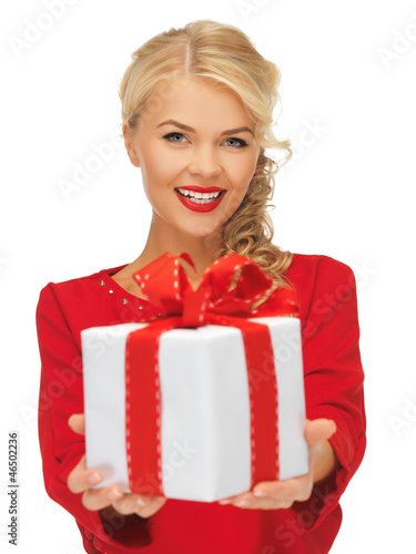 Photo: lovely woman in red dress with present lovely woman in red dress with present