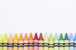 Colourful crayons arranged in a row
