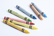 Colourful crayons against white background