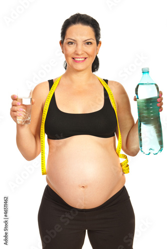 Photo: Happy pregnant woman with water Happy pregnant woman with water