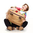 Pretty woman packs her overcrowded bag for holiday