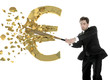 businessman breaks the euro with a baseball bat