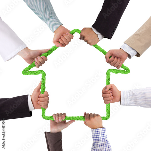 Photo: Hands holding rope forming house Hands holding rope forming house