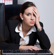 Tired and stressed businesswoman in her office