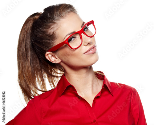 Photo: Portrait of a beautiful young woman wearing glasses Portrait of a beautiful young woman wearing glasses