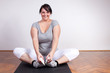 Photo: Happy overweight woman exercising/stretching Happy overweight woman exercising/stretching