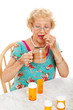Healthy Senior Woman Takes Medication