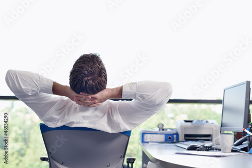 Photo: happy young business man at office happy young business man at office