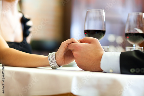 Photo: Young couple having a romantic dinner Young couple having a romantic dinner