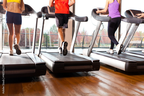 Photo: Running on treadmills in a gym Running on treadmills in a gym