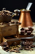 Old coffee grinder and coffee with cardamom.