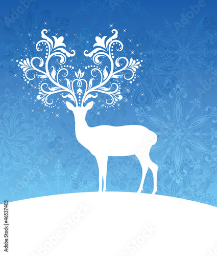 Vector: Deer with patterned horns standing on a hill. Deer with patterned horns standing on a hill.