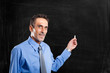 Man showing an empty blackboard
