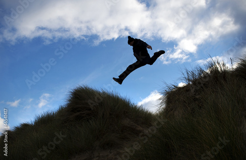 Photo: Man leaps across gap Man leaps across gap
