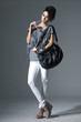 Portrait of young beautiful women with her handbag Posing