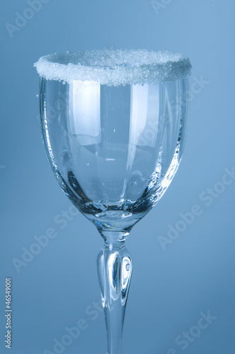 Photo: Wine glass close-up, decoration on the edge of a white crumb Wine glass close-up, decoration on the edge of a white crumb