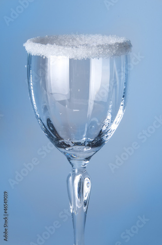 Photo: Wine glass close-up, decoration on the edge of a white crumb Wine glass close-up, decoration on the edge of a white crumb