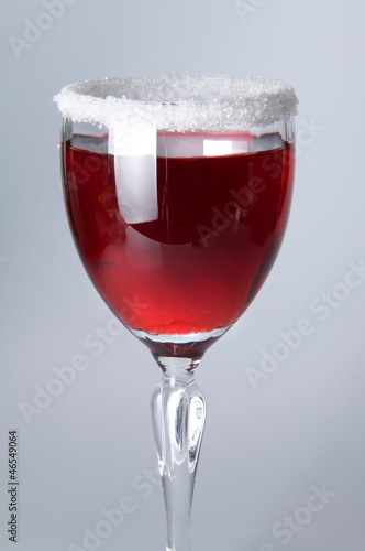 Photo: Wine glass close-up, decoration on the edge of a white crumb Wine glass close-up, decoration on the edge of a white crumb