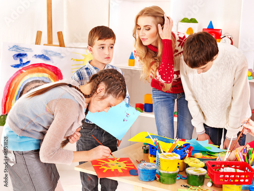 Photo: Child painting at art school. Child painting at art school.
