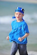 Boy running on the beach