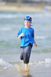 Boy running on the beach