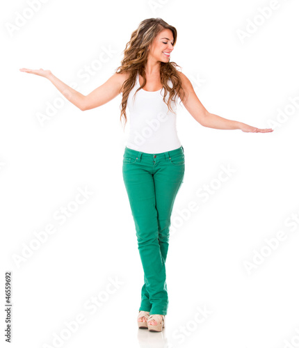 Photo: Woman comparing two objects Woman comparing two objects