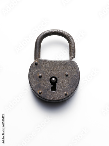 Photo: old padlock on white background old padlock on white background