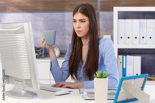 Photo: Young businesswoman busy working Young businesswoman busy working