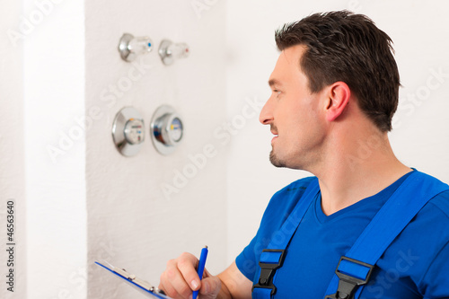 Photo: Technician reading the water meter Technician reading the water meter