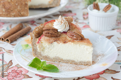 Photo: slice of cheesecake with apples and caramelized pecans slice of cheesecake with apples and caramelized pecans