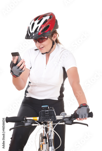 Photo: Girl Cyclist talking on the phone Girl Cyclist talking on the phone