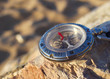 Compass on the beach. Sport items