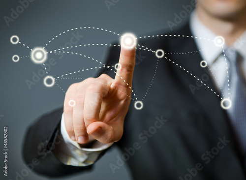 Photo: Businessman pressing a spot in the air Businessman pressing a spot in the air