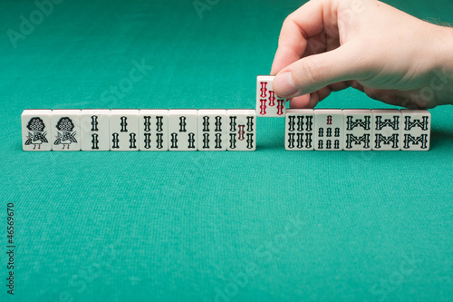 Photo: Smooth table surface with a mahjong on it Smooth table surface with a mahjong on it