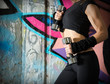 Woman body close up over a graffiti wall