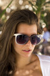 Young woman relaxing at summer lounge