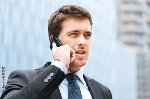 Photo: Businessman talking on the phone Businessman talking on the phone