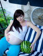 Photo: portrait of pretty young woman expecting a baby,outdoors, portrait of pretty young woman expecting a baby,outdoors,
