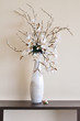 Photo: Flower in the white vase on the table Flower in the white vase on the table