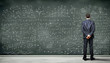 Business person against the blackboard