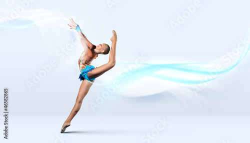 Photo: Young woman in gymnast suit posing Young woman in gymnast suit posing
