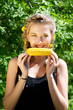 woman eating corn-cob