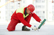worker filling joint with sealing foam