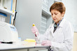 Foto: scientist with Dropper at laboratory scientist with Dropper at laboratory