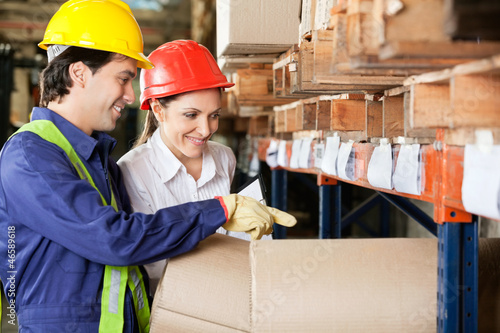 Photo: Supervisor And Foreman Checking Stock At Warehouse Supervisor And Foreman Checking Stock At Warehouse